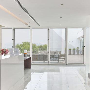 Interior view of Cortizo Bi-Fold Plus window opening to outdoor patio